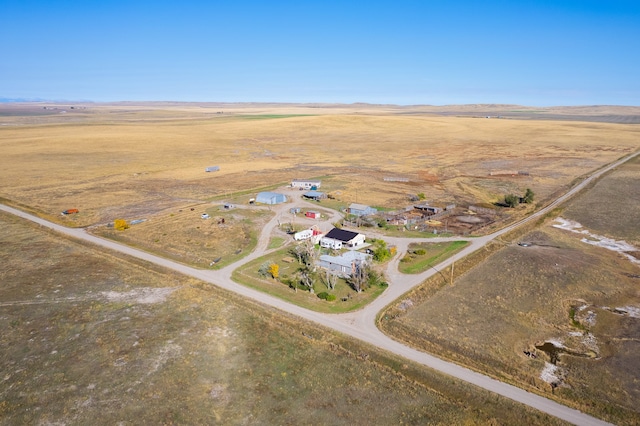 birds eye view of property with a rural view