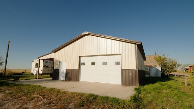 garage with a lawn