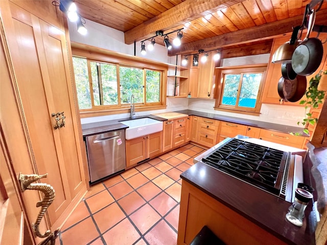 339 Dakota Ave, Whitefish, MT 59937 - kitchen featuring wooden ceiling with exposed beams, dishwasher, a sink, light tile patterned floors, and tasteful backsplash