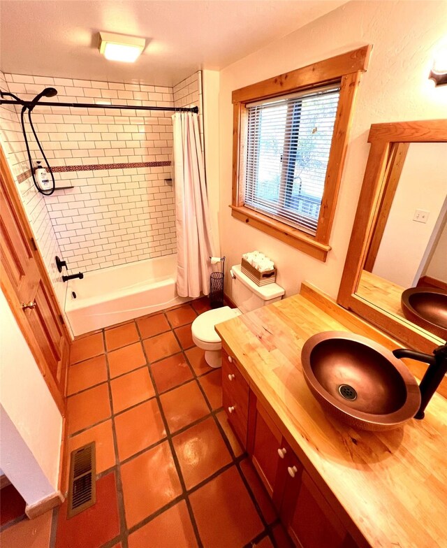 339 Dakota Ave, Whitefish, MT 59937 - full bath featuring tile patterned floors, vanity, shower / tub combo, and toilet
