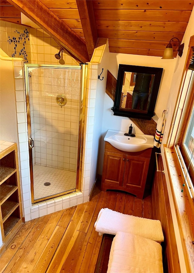339 Dakota Ave, Whitefish, MT 59937 - bathroom featuring vanity, a shower stall, wood ceiling, and wood-type flooring