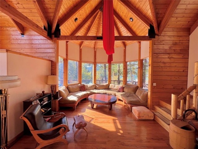 339 Dakota Ave, Whitefish, MT 59937 - living room featuring wood walls, wooden ceiling with exposed beams, high vaulted ceiling, and wood finished floors