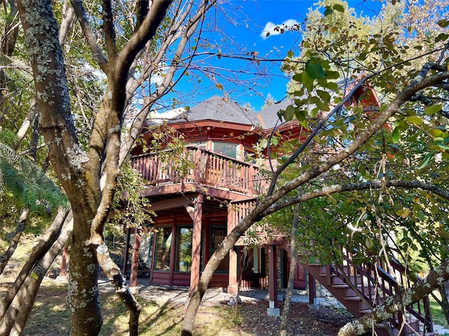 339 Dakota Ave, Whitefish, MT 59937 - back of house with a deck, stairway, and roof with shingles