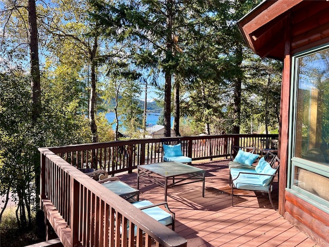 wooden deck featuring a water view