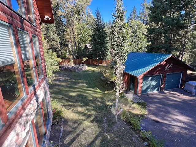 339 Dakota Ave, Whitefish, MT 59937 - view of yard with an outdoor structure and a garage