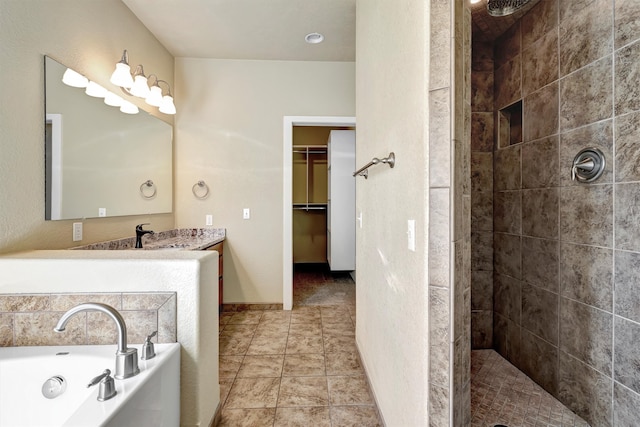 bathroom featuring vanity, plus walk in shower, and tile patterned floors