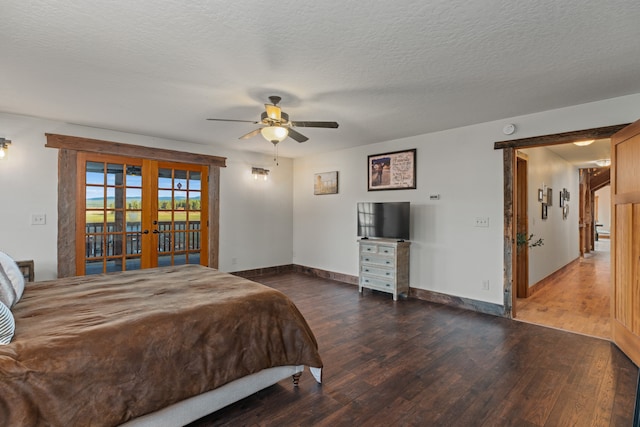 bedroom featuring access to outside, ceiling fan, french doors, a textured ceiling, and dark hardwood / wood-style floors