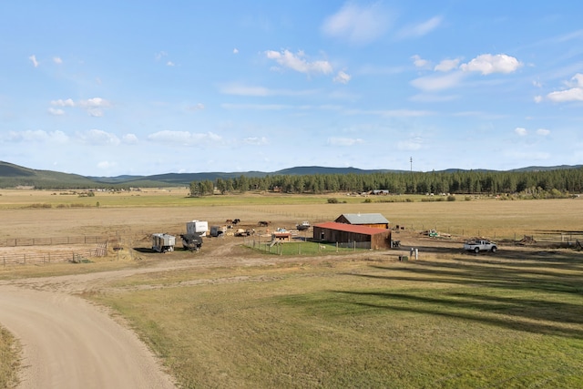 birds eye view of property featuring a mountain view and a rural view