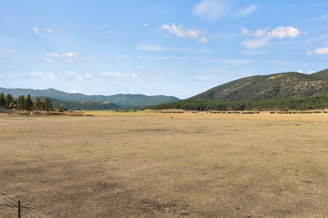 mountain view featuring a rural view