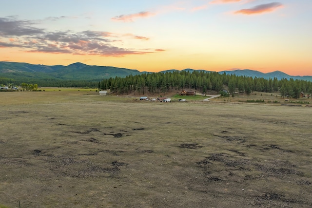 view of mountain feature with a rural view