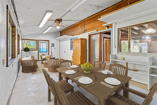 dining space featuring vaulted ceiling and ceiling fan