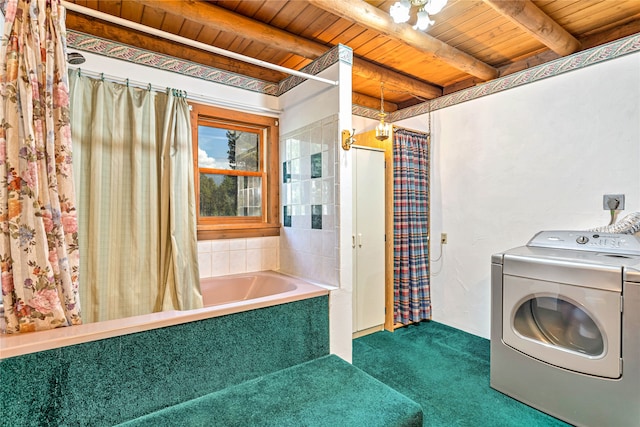 laundry area featuring wood ceiling, dark carpet, and washer / dryer