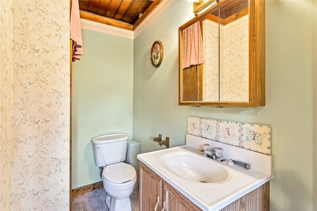 bathroom with wood ceiling, vanity, and toilet