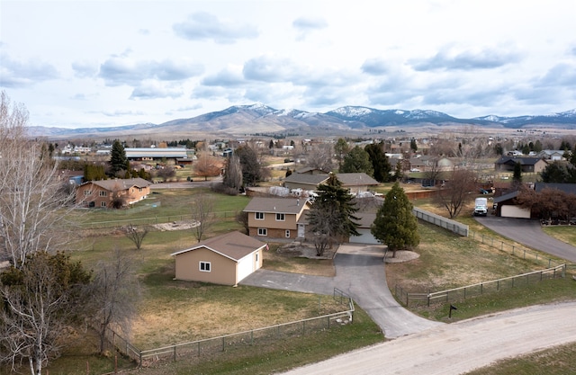 birds eye view of property with a mountain view