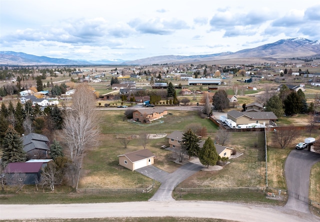 birds eye view of property featuring a mountain view