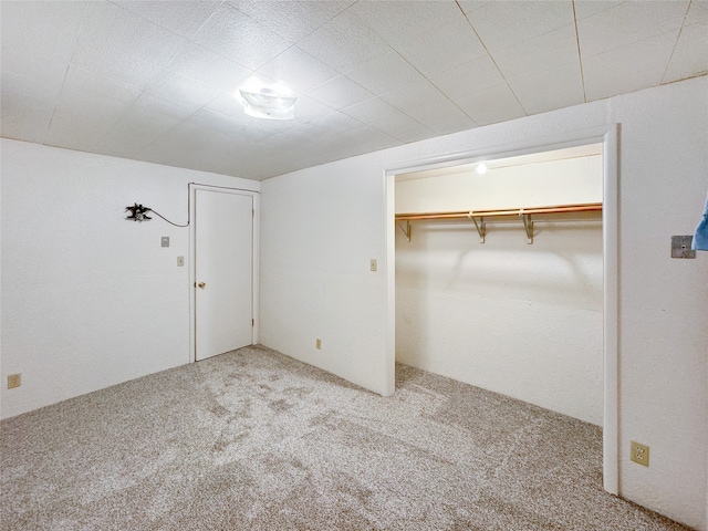 unfurnished bedroom featuring a closet and carpet