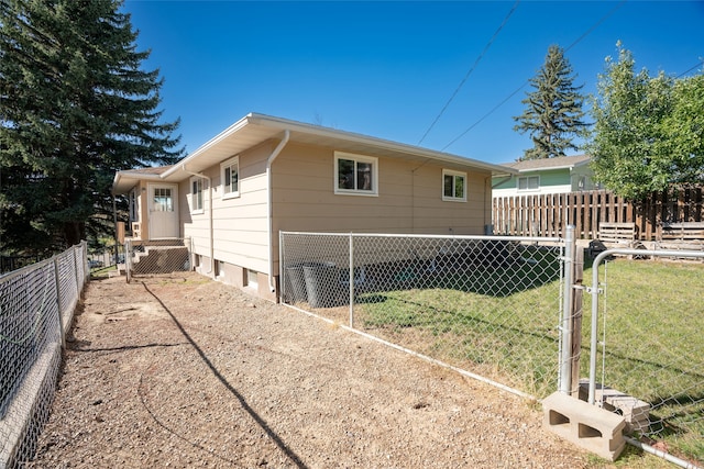 view of property exterior with a yard