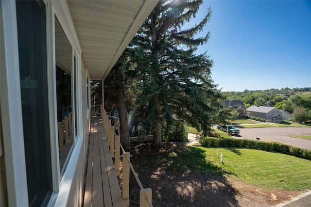 wooden deck with a lawn