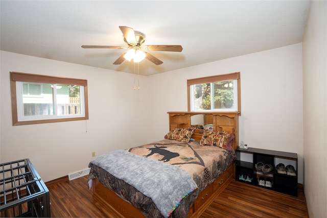 bedroom featuring ceiling fan and dark wood-type flooring