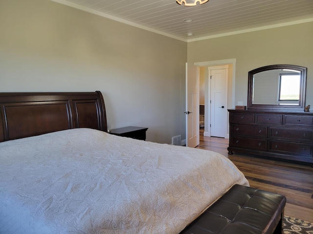 bedroom featuring ornamental molding, dark hardwood / wood-style flooring, and wooden ceiling