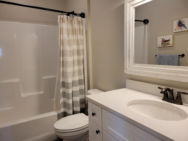 full bathroom with vanity, toilet, and shower / bath combo