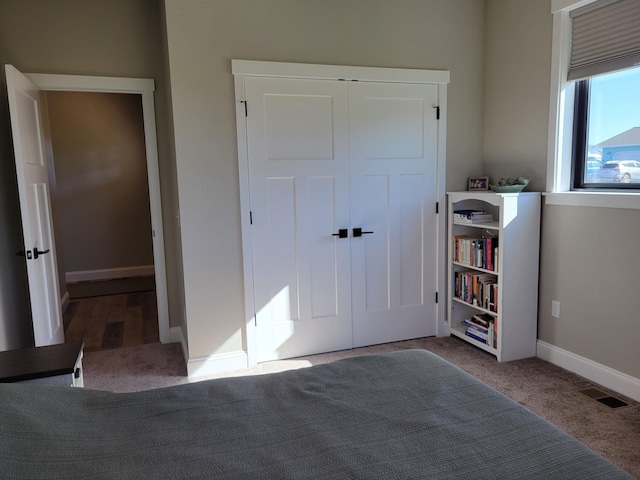 unfurnished bedroom featuring a closet and carpet flooring