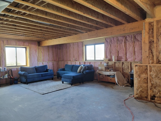 living room with concrete flooring and a wealth of natural light