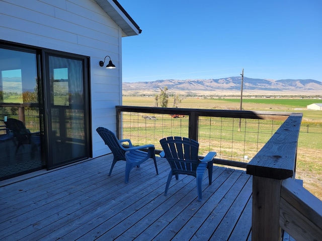 wooden terrace featuring a mountain view