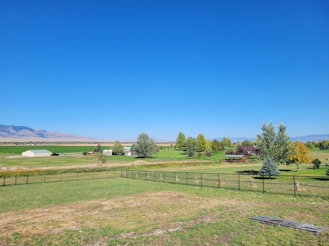 view of yard featuring a mountain view and a rural view