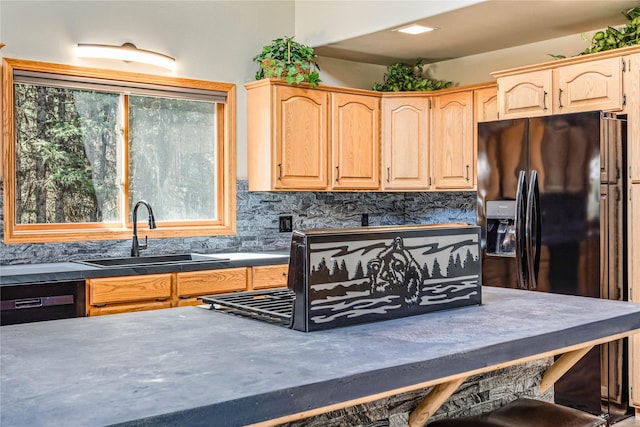 155 Grandview Ln, Seeley Lake, MT 59868 - kitchen with a sink, black appliances, light brown cabinetry, and dark countertops