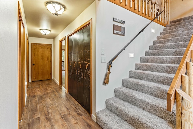 155 Grandview Ln, Seeley Lake, MT 59868 - entrance foyer with wood finished floors, stairway, and baseboards