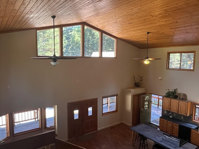 foyer featuring vaulted ceiling, wooden ceiling, and ceiling fan