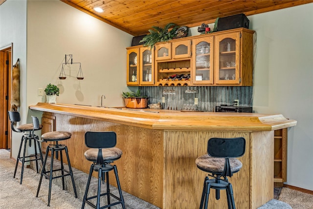 155 Grandview Ln, Seeley Lake, MT 59868 - indoor wet bar with light carpet and wood ceiling
