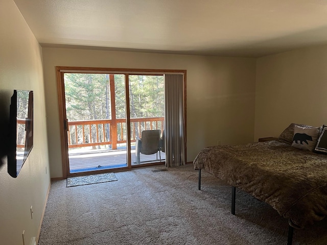 carpeted bedroom featuring access to outside