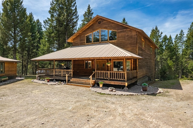 155 Grandview Ln, Seeley Lake, MT 59868 - rustic home featuring covered porch