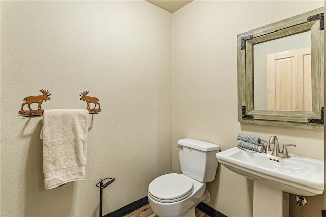155 Grandview Ln, Seeley Lake, MT 59868 - bathroom with toilet and wood finished floors