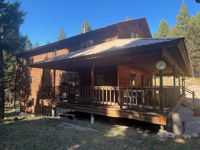 rear view of house with a wooden deck