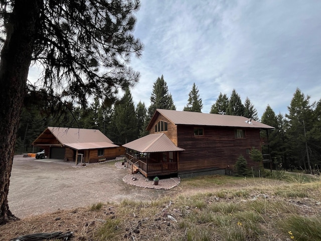 rear view of house with a garage