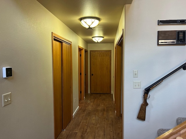 corridor with dark hardwood / wood-style floors