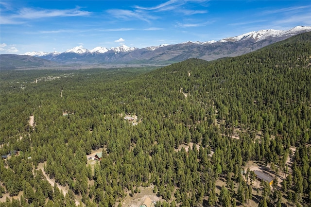 155 Grandview Ln, Seeley Lake, MT 59868 - drone / aerial view of a heavily wooded area and a mountainous background
