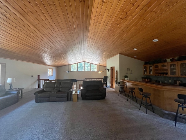 living room featuring bar, wood ceiling, and vaulted ceiling