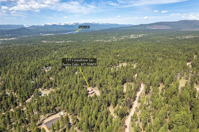 155 Grandview Ln, Seeley Lake, MT 59868 - aerial view of a heavily wooded area and a mountainous background
