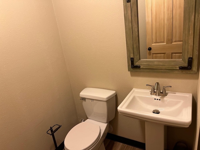 bathroom with toilet and sink