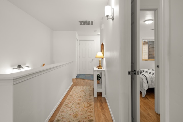 corridor featuring light hardwood / wood-style flooring