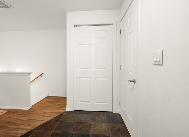 corridor featuring dark wood-type flooring