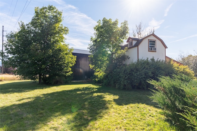 view of yard with an outbuilding and a pole building