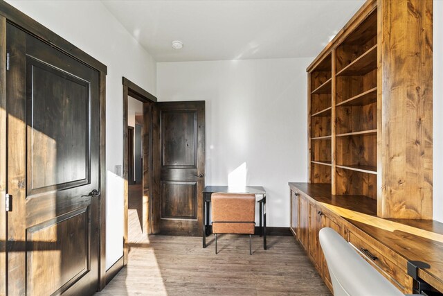 office area with light hardwood / wood-style floors and a wealth of natural light