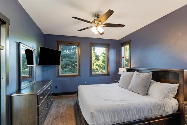 bedroom featuring dark wood-type flooring and ceiling fan