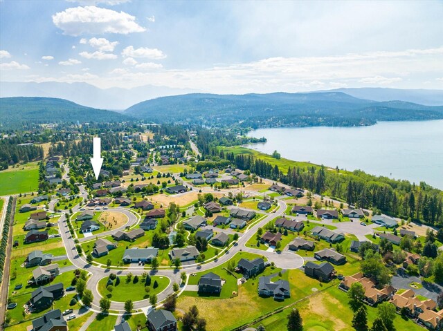 bird's eye view featuring a water and mountain view