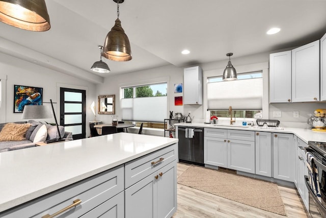 1010 7th St E Unit A, Whitefish, MT 59937 - kitchen with dishwashing machine, a sink, light countertops, pendant lighting, and recessed lighting